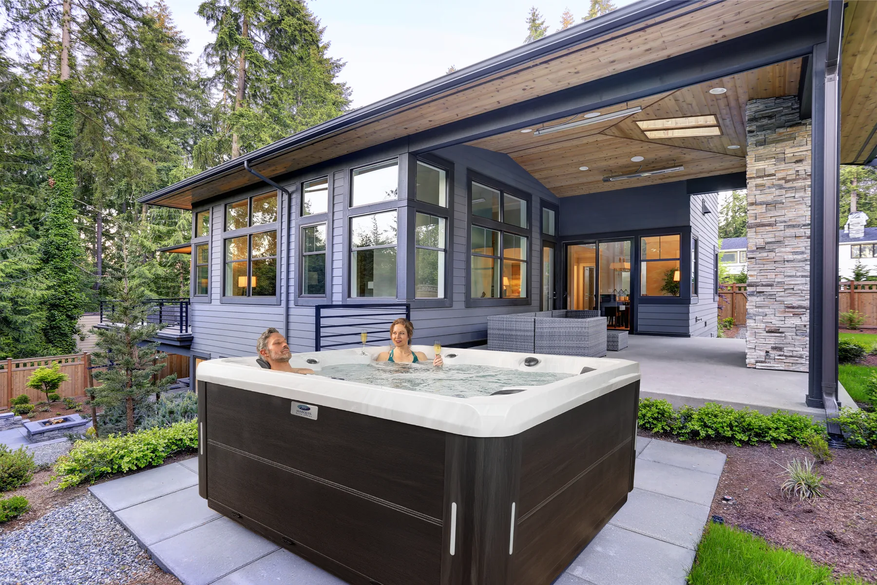 Outdoor hot tub beside a modern home